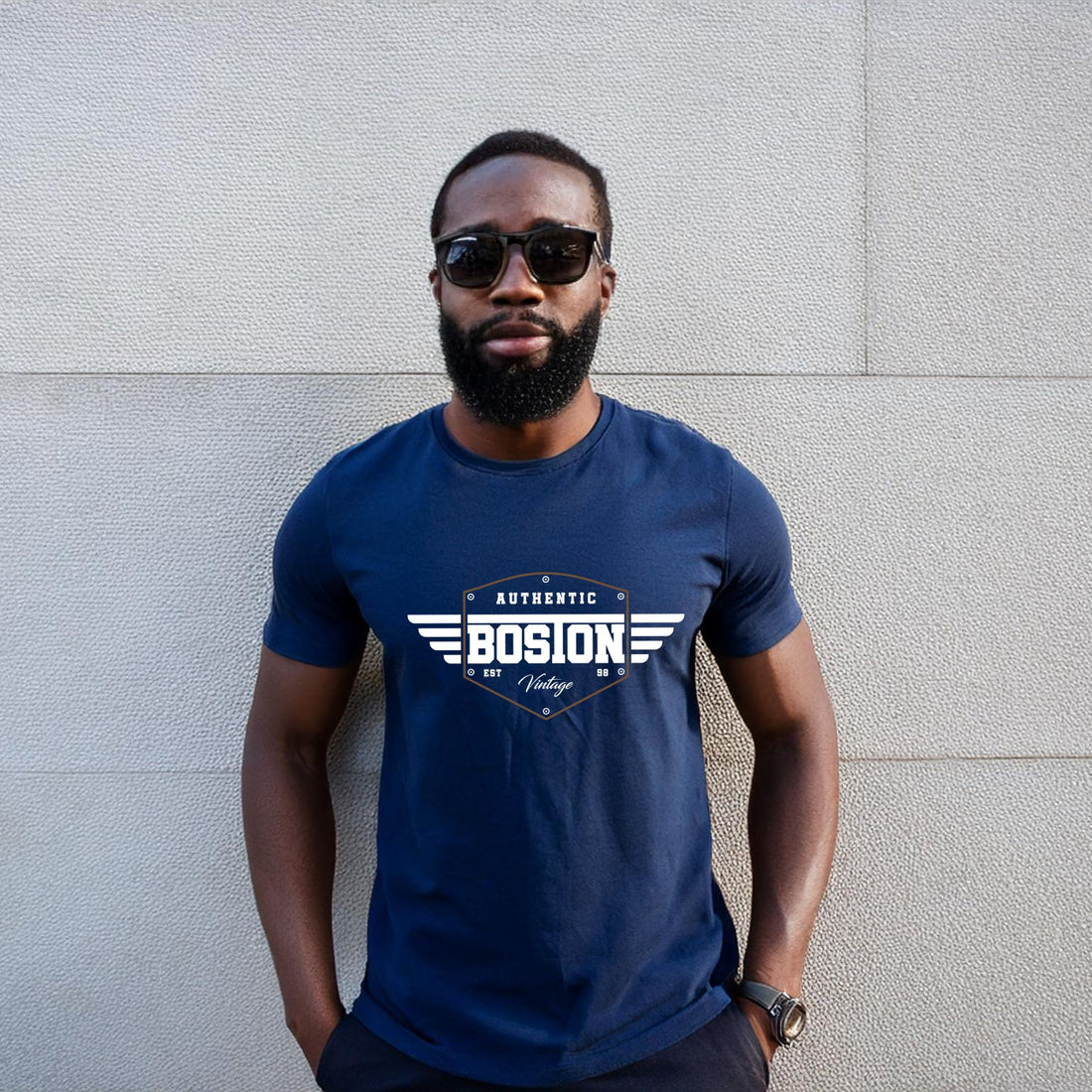 Man wearing a dark gray t-shirt with "Bosion" logo and vintage winged design.