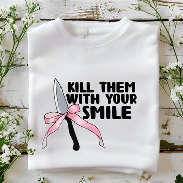Bold white sweatshirt featuring 'Kill Them with Your Smile' graphic with a knife and pink bow. Cozy and edgy design for women